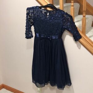 Navy Bonnie Jean dress w/floral decor on bodice & belt. Tulle bottom. Girls 12